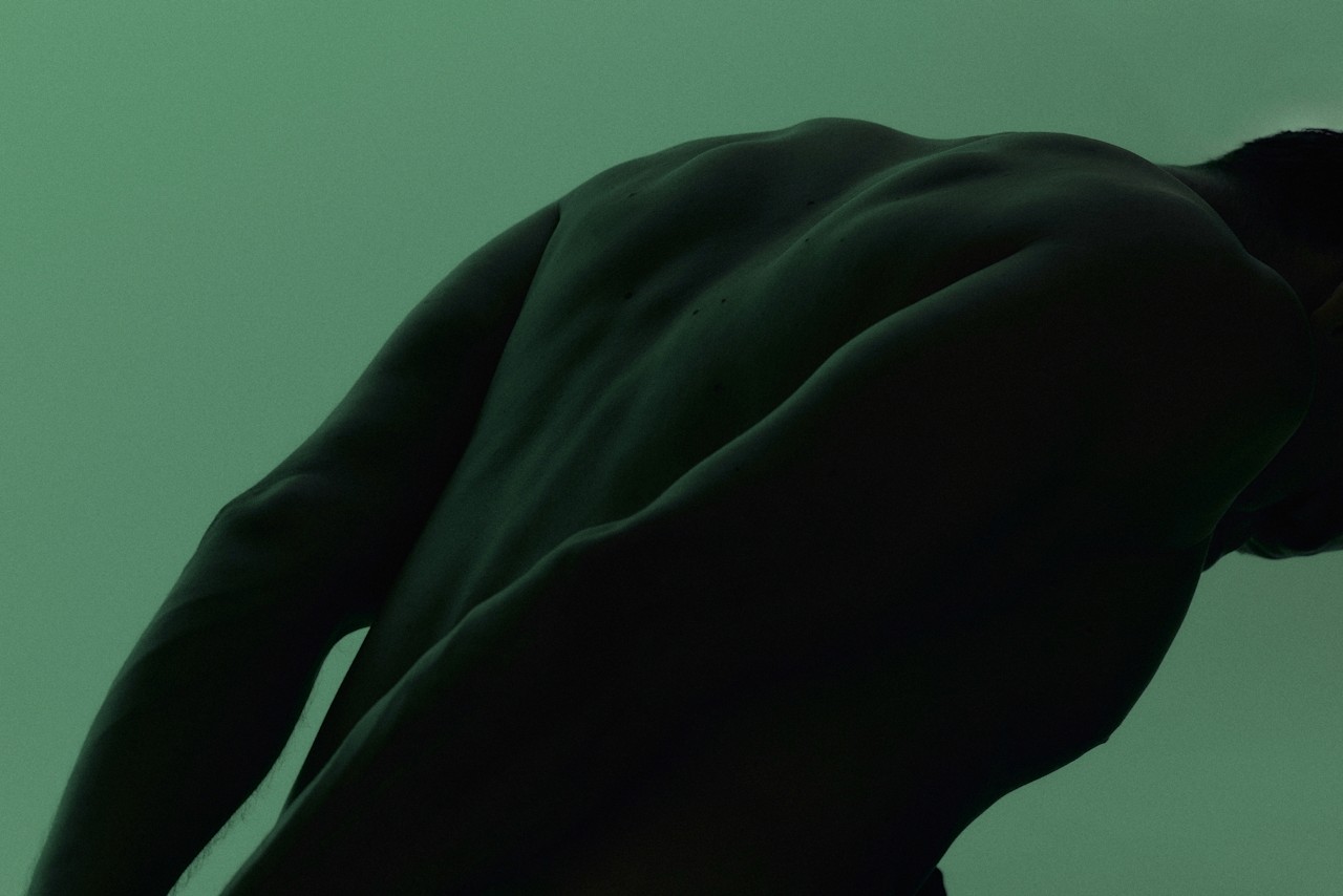 A man performing a yoga pose.