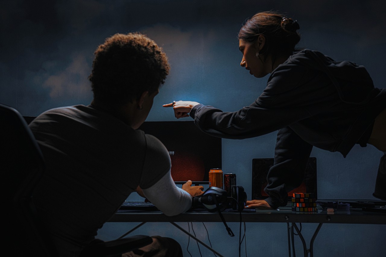 Two teammates in discussion.