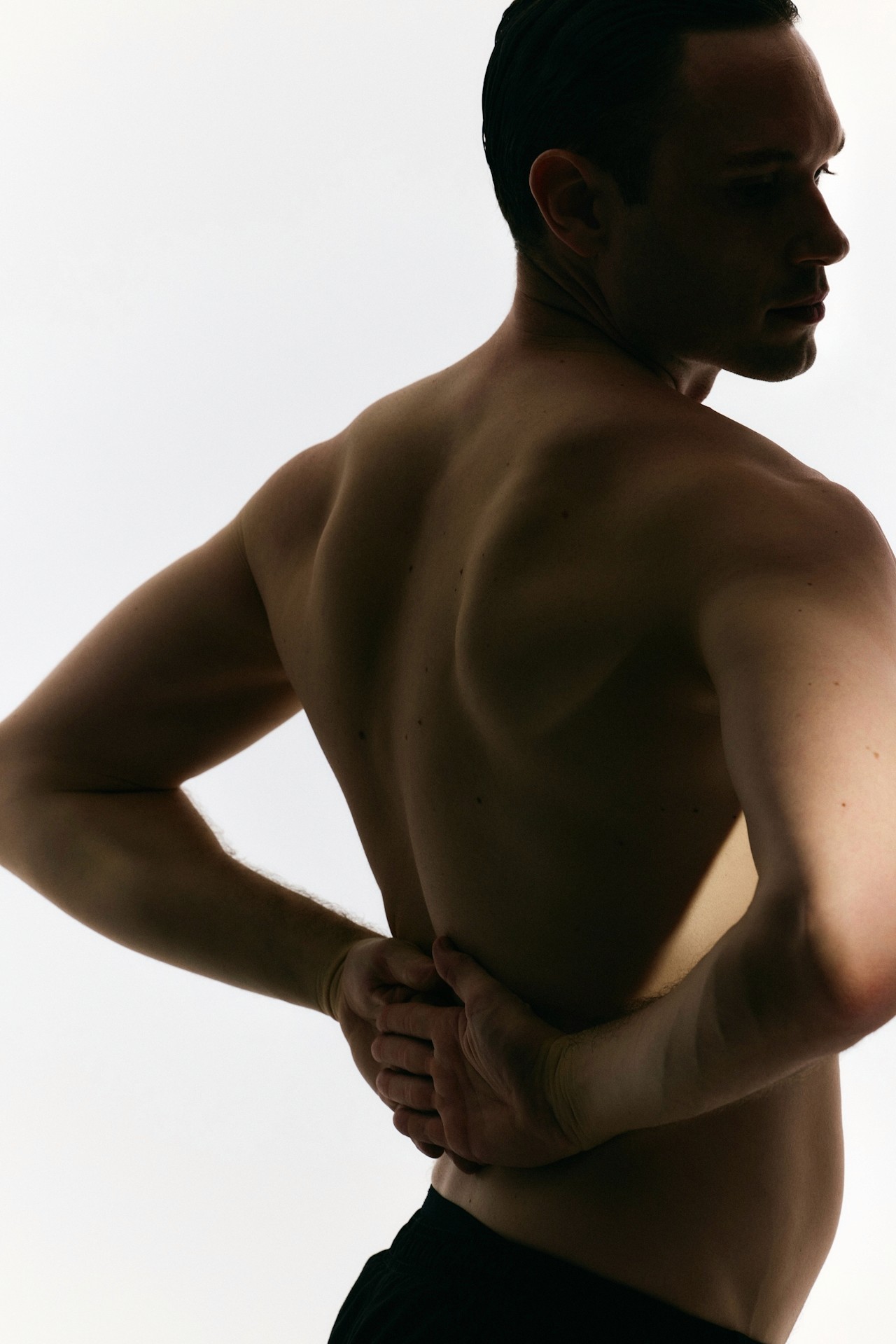 A controlled back stretching pose.