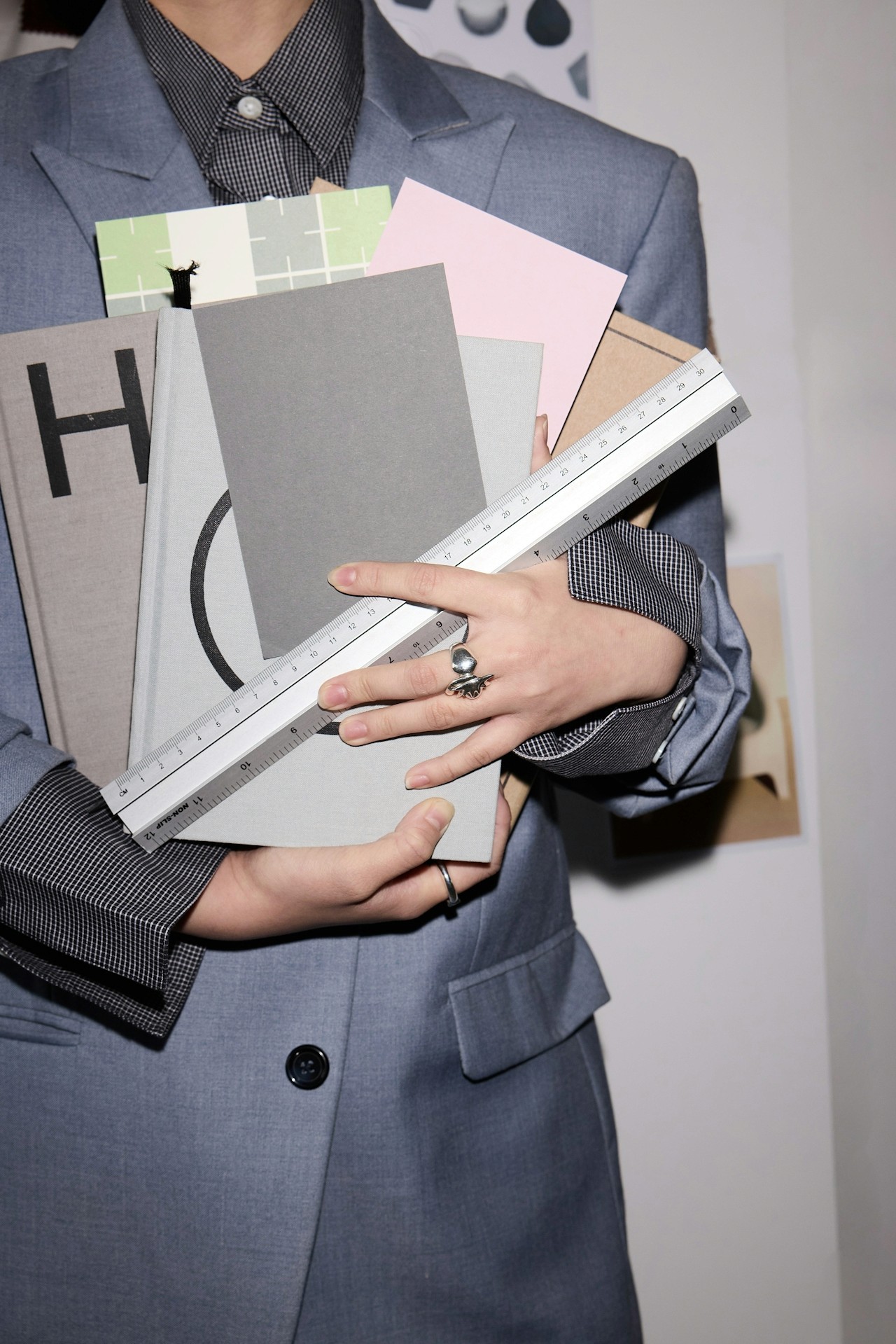 Women holding office files and accessories.