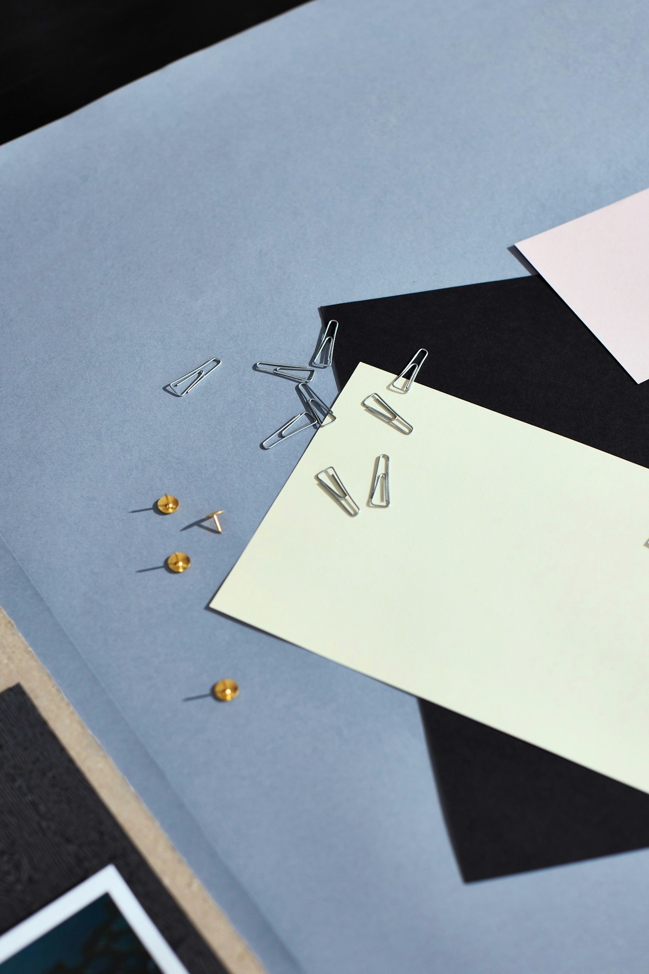 Office files with pins laid out on a work table.