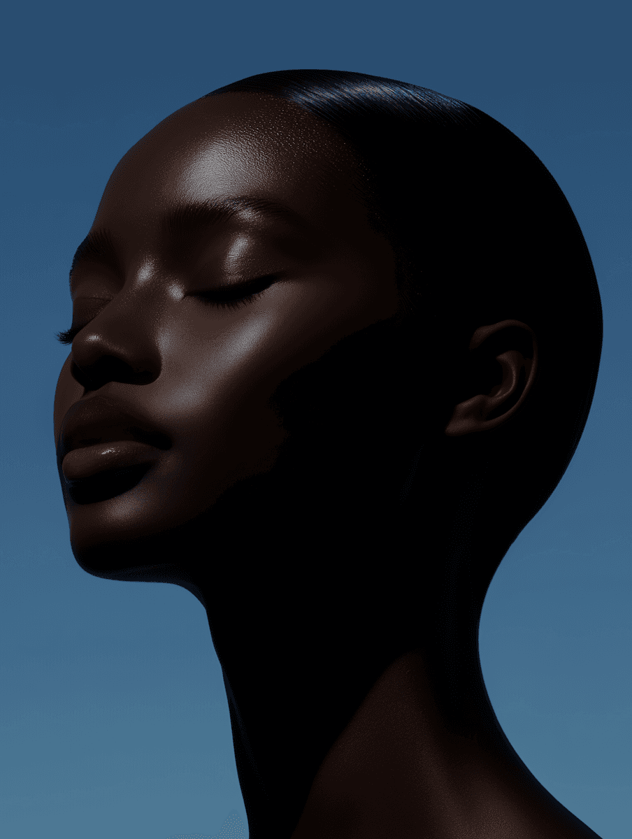 A serene profile portrait of an individual with dark, lustrous skin and closed eyes, showcasing a smooth, glowing complexion under soft lighting. The subtle highlights on the cheekbone and forehead emphasize healthy, hydrated skin against a tranquil blue background. This image is ideal for promoting high-end skincare, beauty, or wellness products, conveying a sense of calm, natural radiance, and self-care. It would be a perfect visual element for a product or lifestyle section on a **Liqua Premium Ecommerce template**, enhancing a brand's luxurious and natural aesthetic.