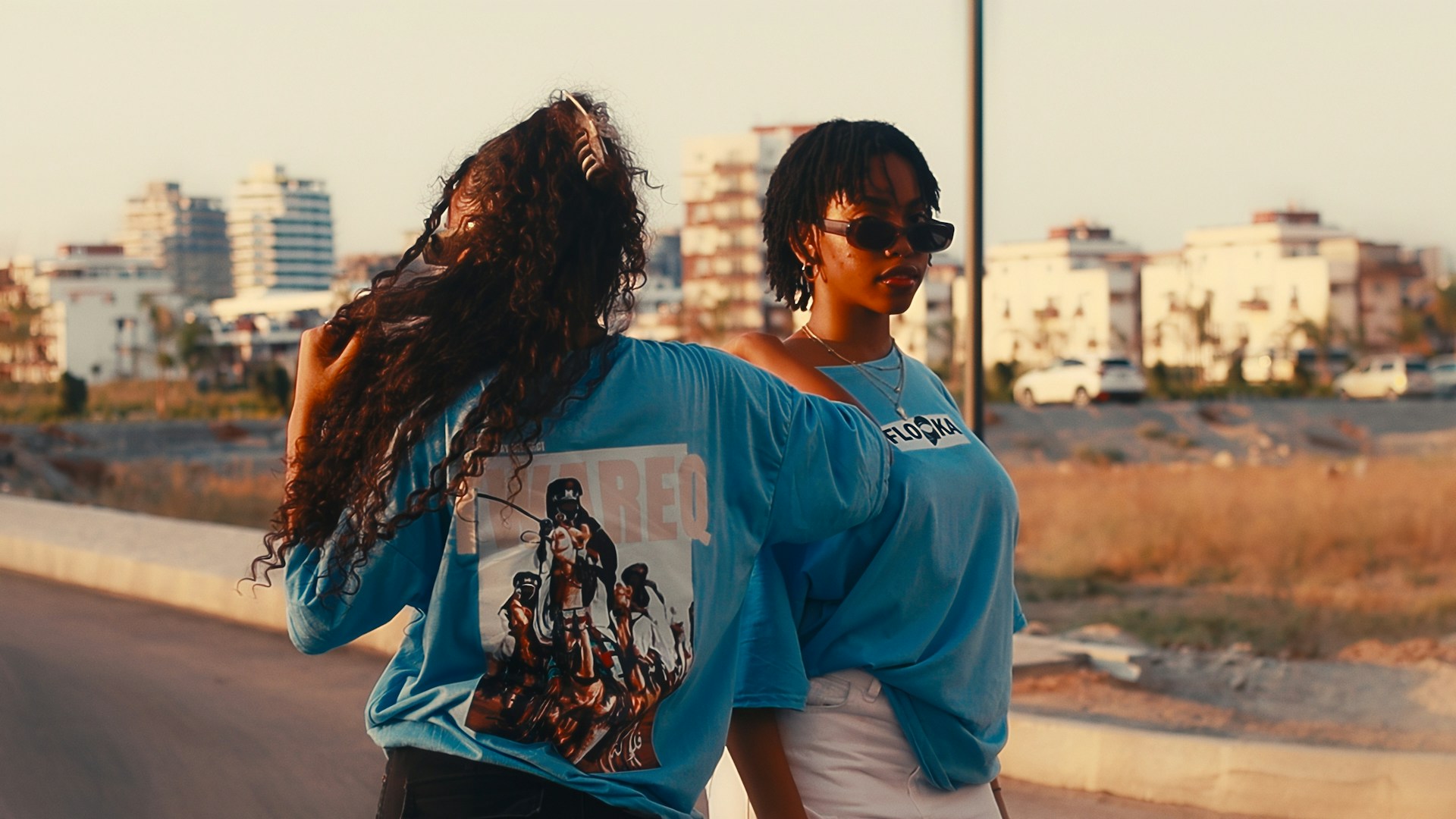 Wide shot of 2 models wearing graphic tee from ordinary garments