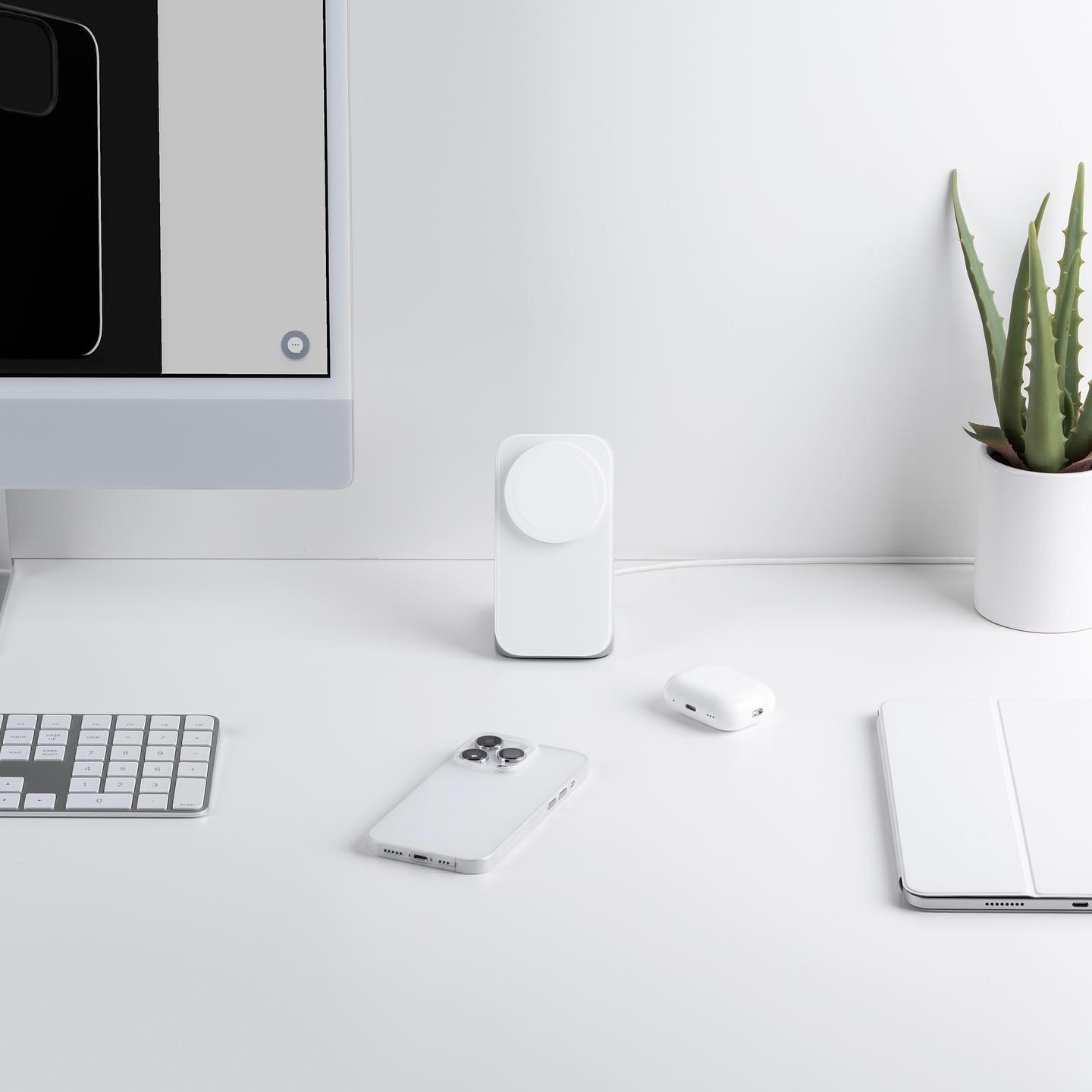 workspace phone with iphone and charger