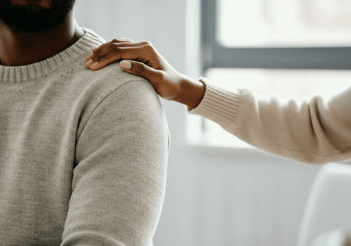 grayscale photo of a person wearing a striped shirt